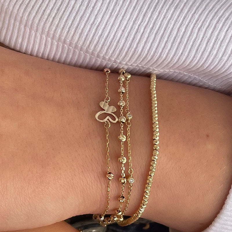 צמיד לאישה מזהב צהוב 14 קראט - אנסוף כדורים מנצנצים צמיד לאישה מזהב צהוב 14 קראט - אנסוף כדורים מנצנצים