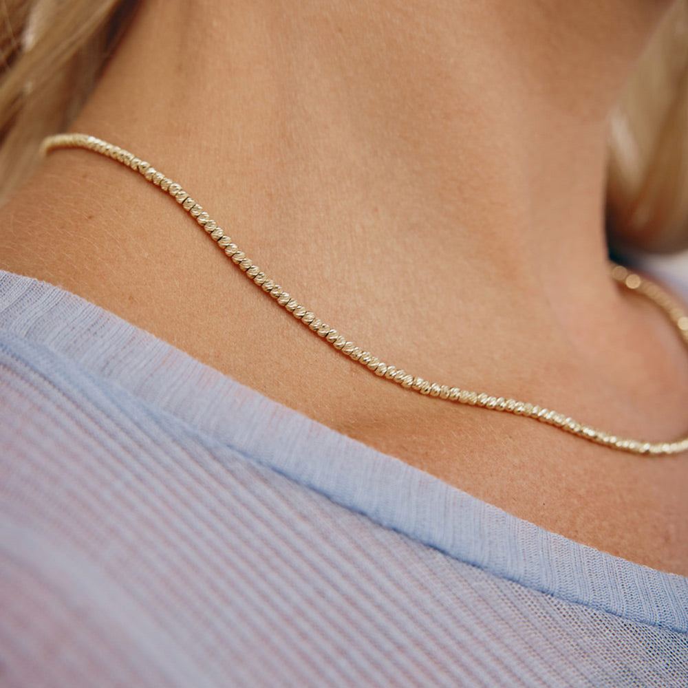 שרשרת לאישה מזהב לבן 14 קראט - כדורים שרשרת לאישה מזהב לבן 14 קראט - כדורים