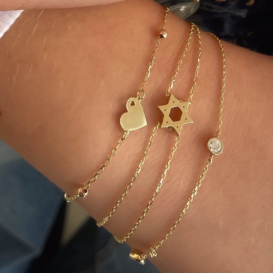 צמיד לאישה מזהב צהוב 14 קראט - לב מלא כדורים